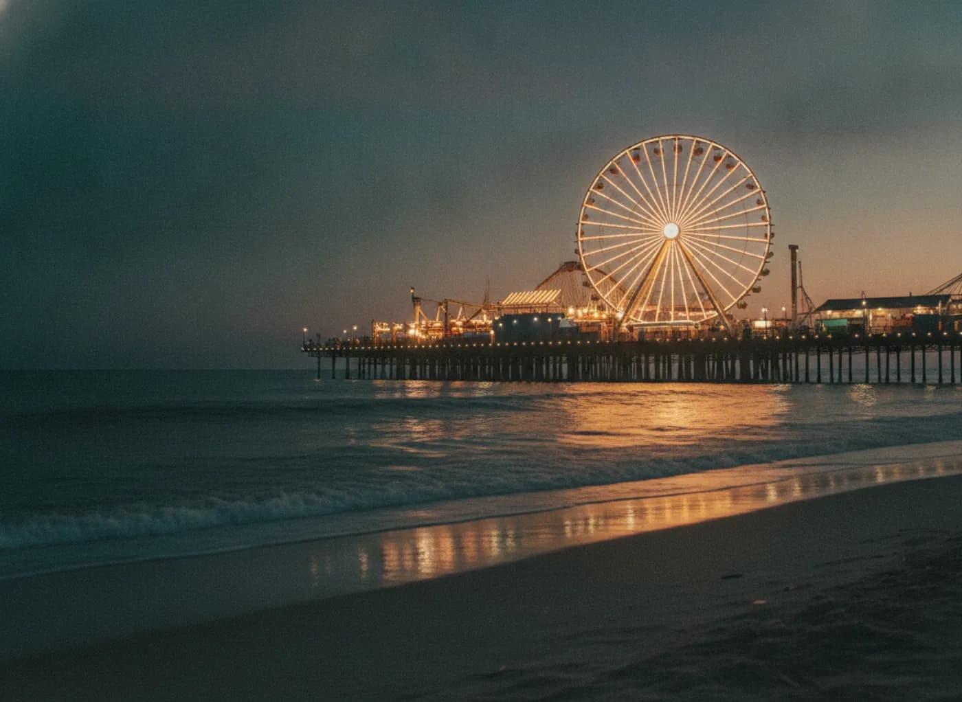 Filming location Atlantic City amusement pier and ferris wheel lit at dusk